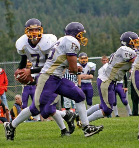 Quarterback Tanner Buck tossed two touchdown passes in the Wolverines season-ending 42-16 loss Thursday to King's High School. Above