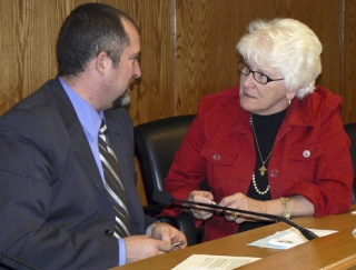 Sen. Mary Margaret Haugen and Senator-elect Kevin Ranker discuss transportation issues after a meeting of the Senate Transportation Committee.