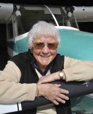 Dodi Gann poses for a photograph in 2008 beside a favorite plane.
