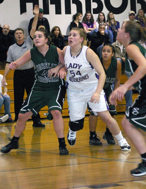 Friday Harbor's Kelsey Barnes (54) scored 14 points and had 17 rebounds in the Wolverines' 54-43 defeat of Orcas