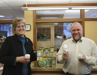 Martha Warachowski and OPALCO General Manager Randy Cornelius with the new energy efficiency kit.