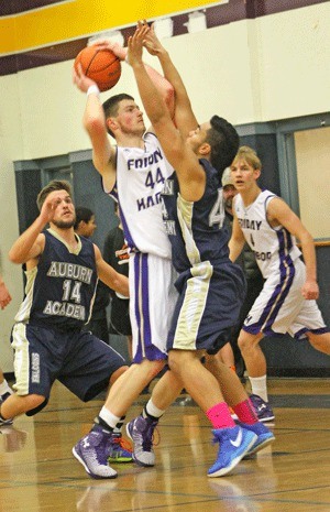 Kyle Jangard elevates for a shot over the Falcons Sheldon Seui in Friday Harbor's regular-season contest against Auburn Adventist at home Jan. 31. Jangard scored a team-high 18 points in a loss to the Falcons Feb. 17