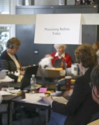 The Elections Department A Team processes ballots today in the county elections office. As of Monday at 5 p.m.