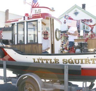 David Lee Spurgeon rode in his 'Little Squirt' tugboat in the Friday Harbor Fourth of July parade in 2007.