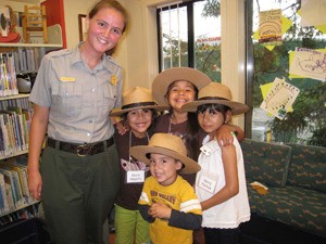Ranger Reana Parsons poses for a group shot with children participating in National Parks ‘Best Idea’ grant funded outreach program.