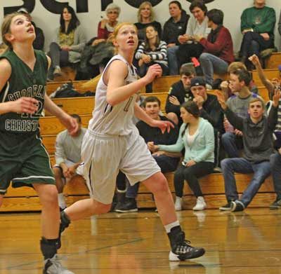 Alie Galt readies for a rebound in the Wolverines league-opening win at home over Shoreline Christian. Galt played limited minutes in the contest because of a lingering ankle injury.