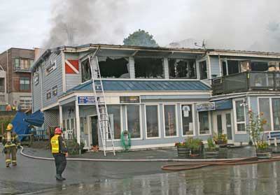 Smoke billows from the roof of Downriggers Restaurant in the wake of the early morning Aug. 17 fire that destroyed the Friday Harbor waterfront restaurant.