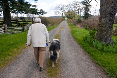 The late Dodie Gann and friend on a stroll at her home at Red Mill Farm in San Juan Valley.