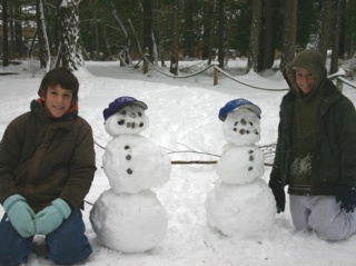 Seven more and they'd have a team ... Connor and Sam Daniels of Cape San Juan pose next to their snowmen