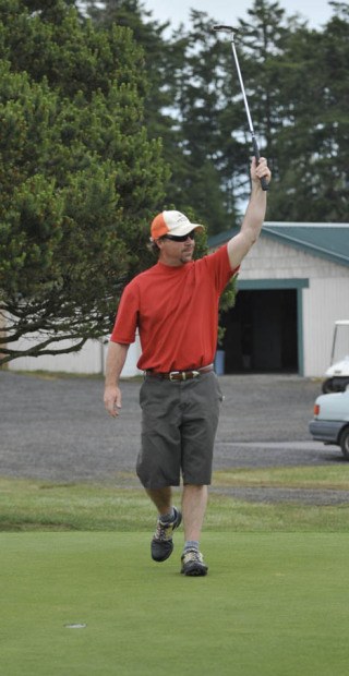 Ron Bates celebrates after dropping a 12-foot putt for eagle on the final hole Saturday