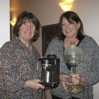 I'll trade you a coffee maker for that lamp ... Pat Hansen and Phyllis Davis show some of the items they plan to take to the Great Island Giveaway and Social.
