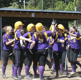 Kerri Goff is high-fived after a three-run homer in the fourth inning