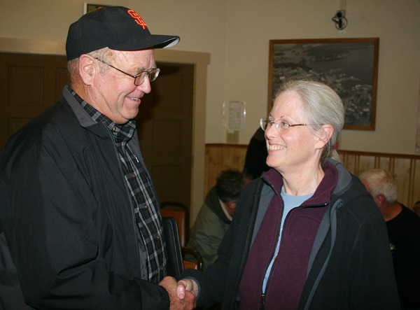 San Juan Fire District Commissioner Bob Jarman and Friday Harbor Mayor Carrie Lacher visit after the Town Council's Nov. 9 meeting. Town and district officials are ironing out an interlocal agreement for interim leadership