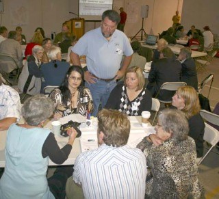Dan Ward of San Juan Transit listens to a group discussion on possible action steps to take to make public transit a reality in the San Juan Islands. About 170 people are participating in the summit