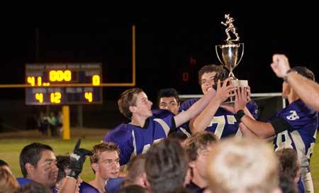 The Wolverines hoist the Island Cup trophy following a victory in the annual inter-island rivalry against Orcas in the 2012.