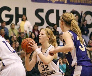 Sophomore Maggie Anderson zeros in before knocking down the first of two high-pressured free throws. Anderson tied the game at 30-30