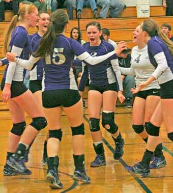 The Wolverines celebrate a winning point in an mid-season match at home against Orcas.