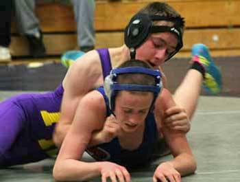 Friday Harbor's Benjamin Ware gains the upper hand in an early season match against a Tacoma Baptist opponent.