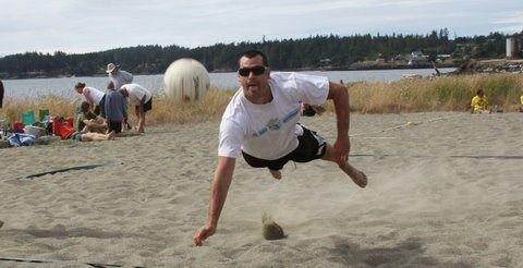 Shawn Kleine dives for the ball at Island Rec’s V-ball  Tournament.