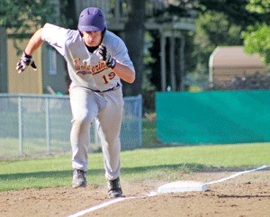 Kai Herko takes off from third base to score the first of Friday Harbor's seven runs in the Wolverines 7-3 victory at home over Nooksack Valley