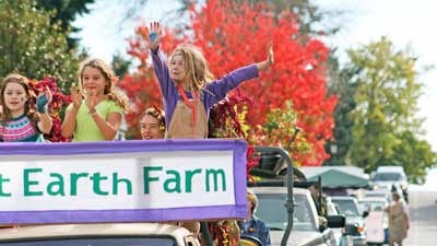 Spectators of the 2013 Fall Farm Parade are greeted by smiles