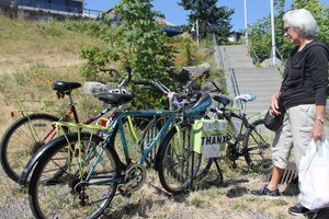 Janet Hart checks out the free-bicycles at the turnaround by the Port of Friday Harbor.