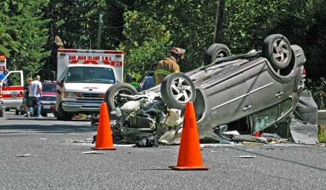 West Valley Road remained closed for more than an hour Thursday afternoon following a single-car collision near Raven Ridge Road. Seat belts are credited with helping two children and a woman escape with only minor injuries.
