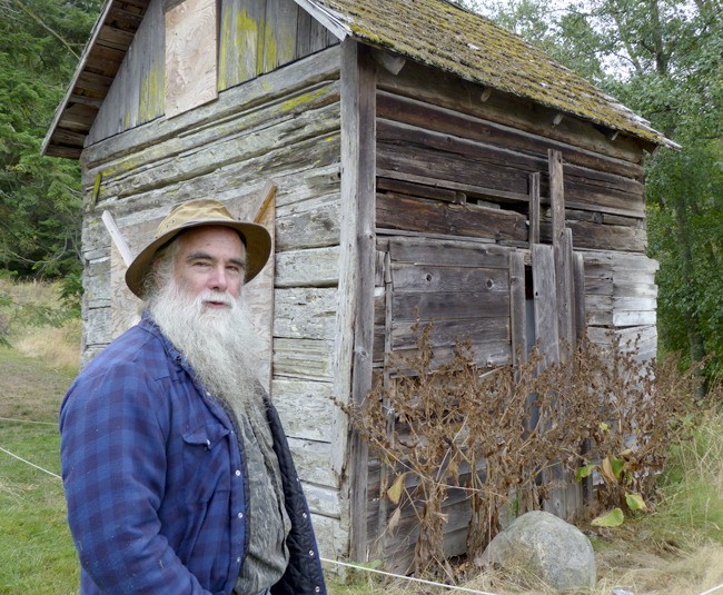 Restoration Specialist David Rogers will be using authentic 1900s tools and building techniques to renovate the historic Brann Cabin overlooking Smallpox Bay and the Haro Strait in what is now San Juan County Park.