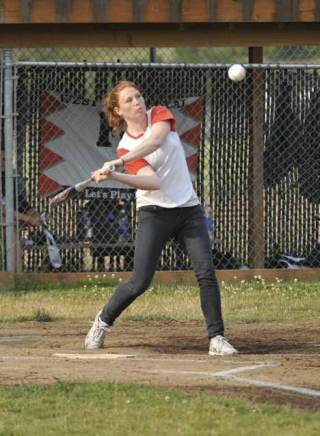 Sea Slugger Tiffany Stephens unloads on a high slow pitch for a single early in the 16 - 6 blowout against Rocky Bay Wednesday. The Sea Sluggers are now 3-2 in B-league play behind 4-0 San Juan Propane.