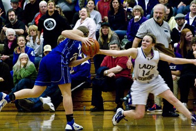Friday Harbor co-captain Mandy Turnbull puts on the breaks to attempt a steal in the Wolverines league title-clinching victory over Orcas