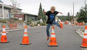 A young lad hurdles a construction cone on Friday Harbor's Blair Avenue