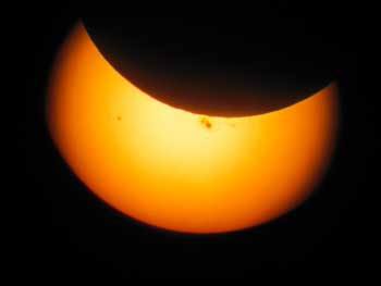 A pair of sunspots standout in the center of a photograph taken on San Juan ISland of the Oct. 23 solar eclipse