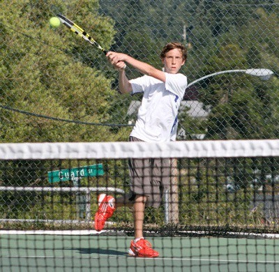 Friday Harbor No. 1 singles player Parker Satin wallops a backhand return in a three-set victory over Coupeville counterpart