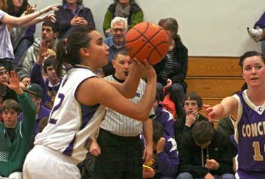Friday Harbor senior Liz Taylor zeros in on a free-throw attempt in an early season victory over Concrete. Taylor scored 13 points to pace the Wolverines win