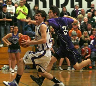 Friday Harbor's Levi Demaris heads to the hoop for a layup in the Wolverines 64-51 playoff victory at home