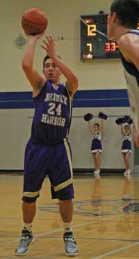 Friday Harbor's C.J. Woods pops in a point from the free-throw line in the Wolverines 54-47 win on the road