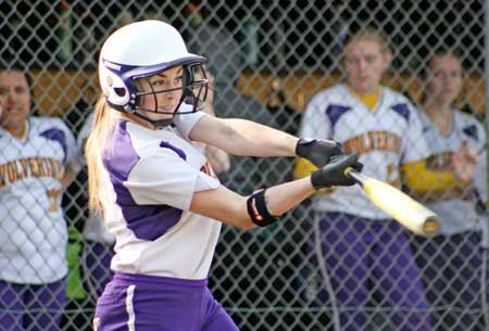 Friday Harbor shortstop Emma Wickman busts out a base hit in the Wolverines win at home over Darrington March 31.