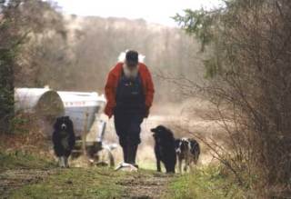 Jim Desermeaux walks his dogs on his False Bay farm. In his life