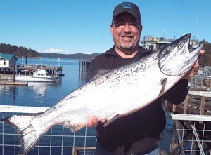 Near-trophy time: Chuck Payne of Friday Harbor reeled in a 20.87 salmon to catapult into second place in Week 9 of the Frank Wilson Fishing Derby.