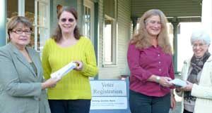 Diane Martindale and Marty Huleatte of the League of San Juans' Women Voters (far left and far right)