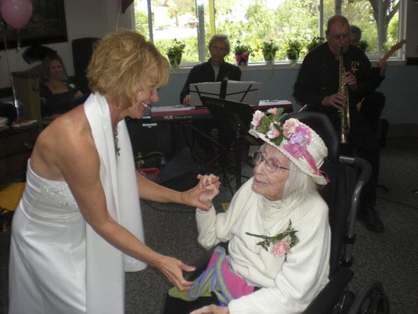 Staff member Cindy Lonsinger dances with resident Helen Brown.