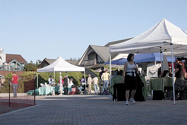 Visitors shop for merchandise at the Arts Market