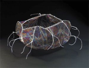 A fiber art mesh-work basket by Lanny Bergner.