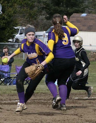 Friday Harbor’s Elle Guard comes up throwing at third base in the Wolverines’ 6-5 heartbreaking loss to Meridian Saturday.