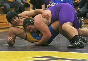 Senior Willy Dunn scores a take down in an early season exhibitionmatch against Tacoma Baptist’s William Edge.