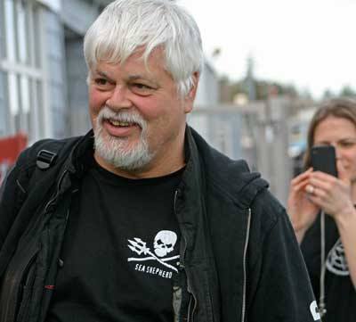 Sea Shepherd's Capt. Paul Watson is greeted by a dozen or so supporters Thursday afternoon at Friday Harbor airport.