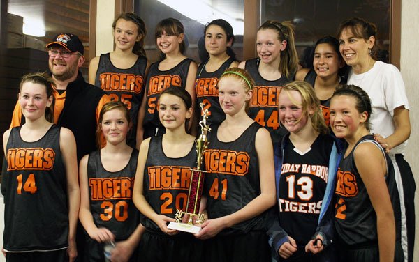 The seventh-grade girls SWISH basketball team took first place in the SWISH tournament Dec. 11 in La Conner. Back row from left