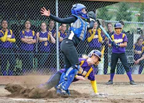Junior Maggie Anderson beats the throw to home and slides in safe in the Wolverines 11-2 victory in the closing game of Saturday's double header against Orcas. Friday Harbor claimed the opener by a score of 5-3.