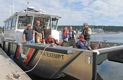 Local officials get acquainted with the equipment and operation of San Juan County Sheriff Department's new public safety boat