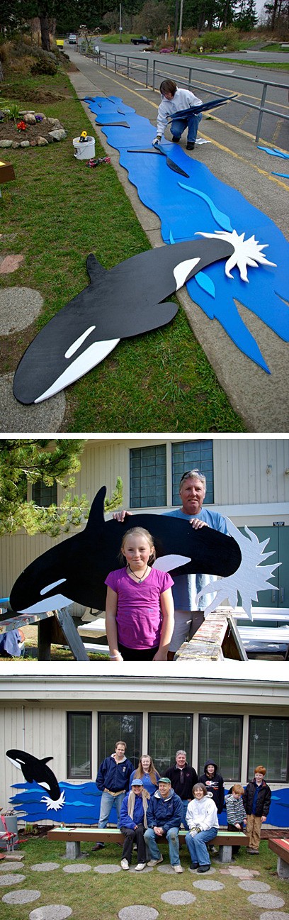 Top photo: Jeanine Earnhart creates the whale scene for the school wall. Middle photo: Allison and Bob Benz with a whale for the scene at The Greeting Place at Friday Harbor Elementary School. Bottom photo: Standing from left